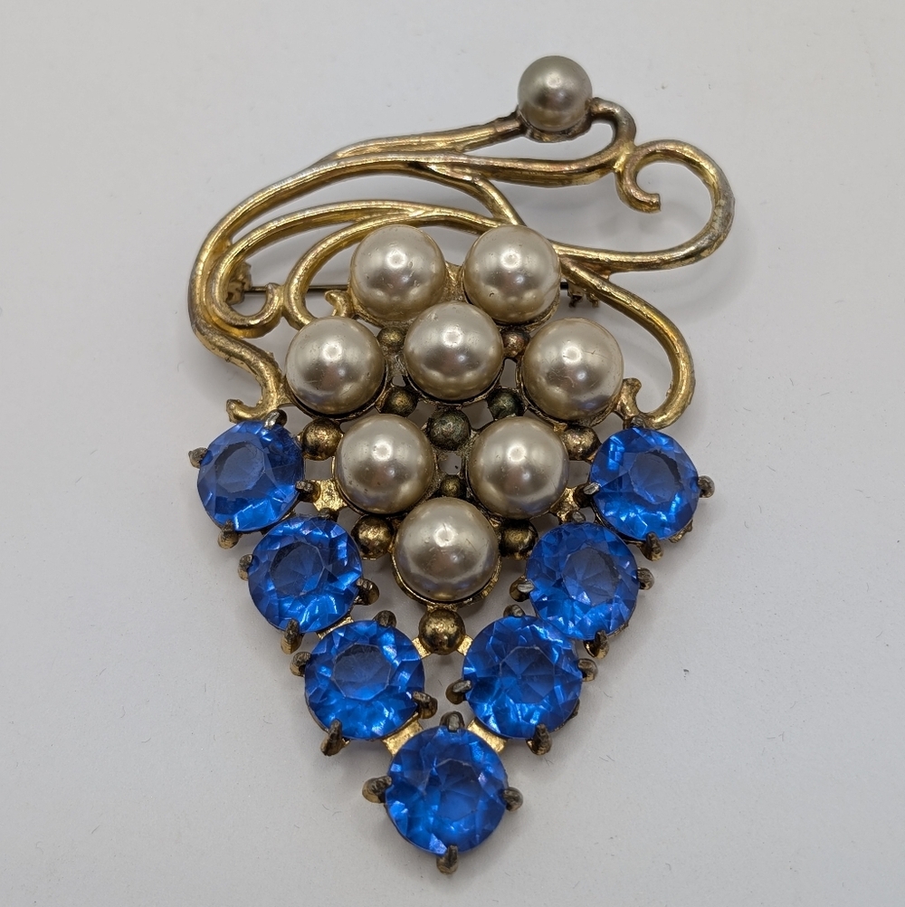 Elegant Gold and Blue Brooch